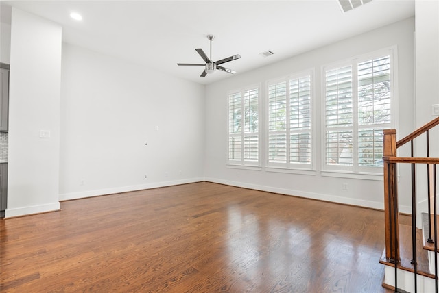 spare room featuring ceiling fan and hardwood / wood-style floors