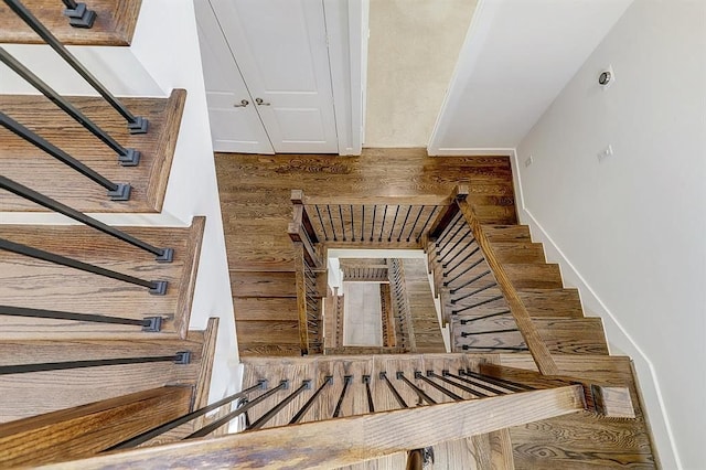 stairs with wood-type flooring