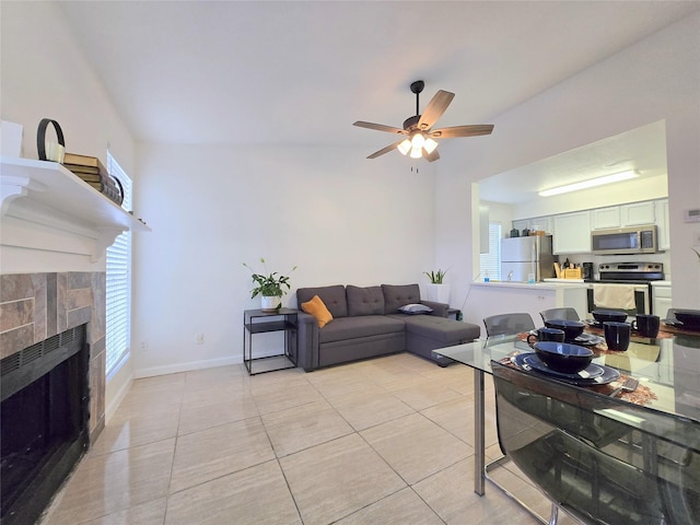 living room with light tile patterned floors and ceiling fan