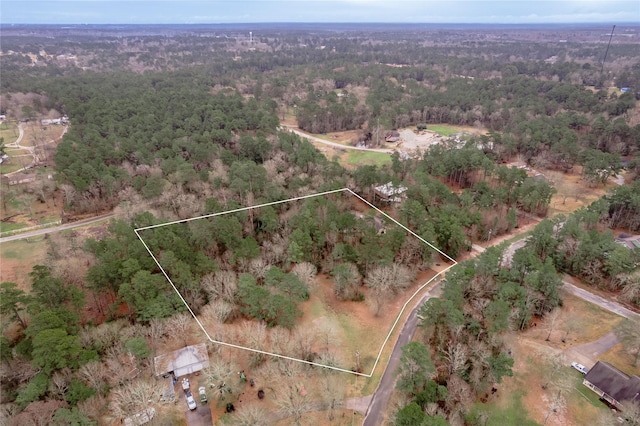 drone / aerial view with a view of trees