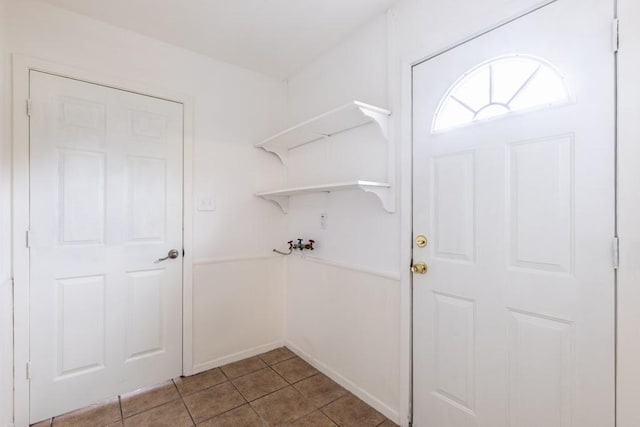 clothes washing area featuring washer hookup, laundry area, and light tile patterned floors