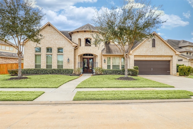 view of front of property with french doors and a front yard