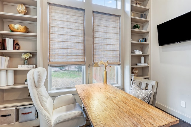 home office featuring built in shelves