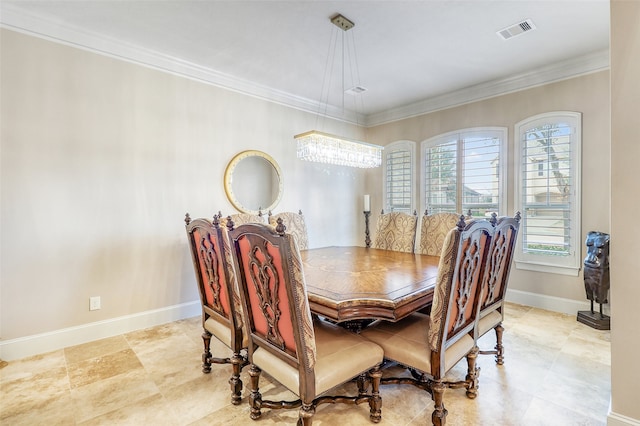 dining room featuring ornamental molding