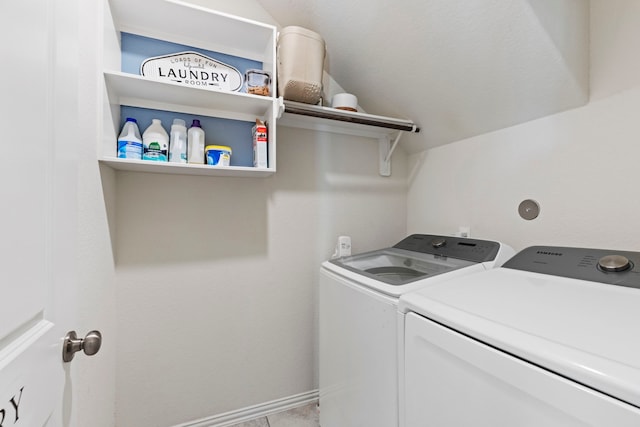 clothes washing area featuring washer and clothes dryer