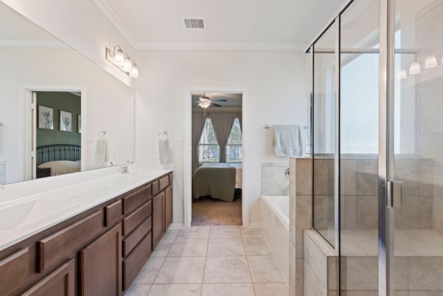 bathroom featuring crown molding, separate shower and tub, vanity, and tile patterned floors