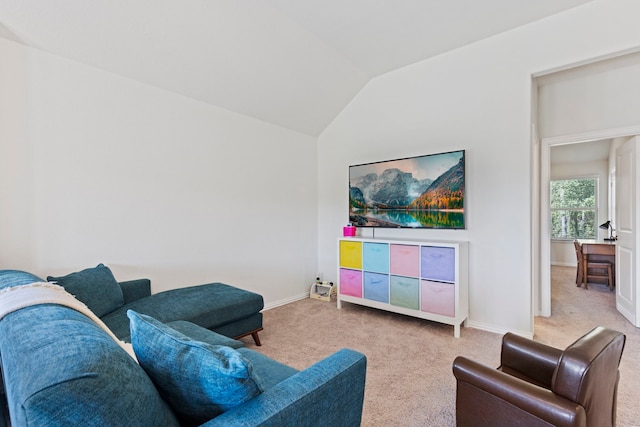 living room with vaulted ceiling and light colored carpet