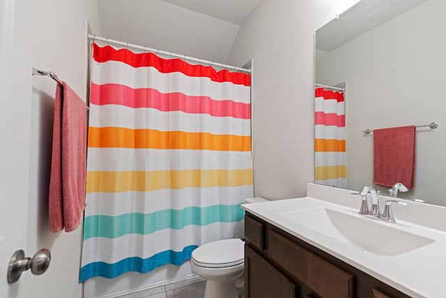 bathroom featuring vanity, tile patterned flooring, toilet, and a shower with shower curtain