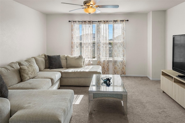 living room with ceiling fan and carpet