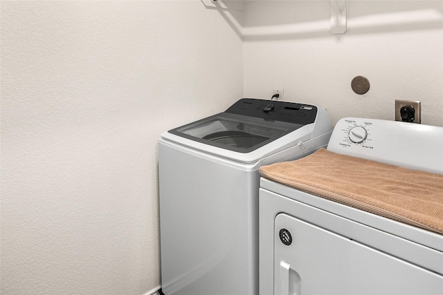 laundry room with separate washer and dryer