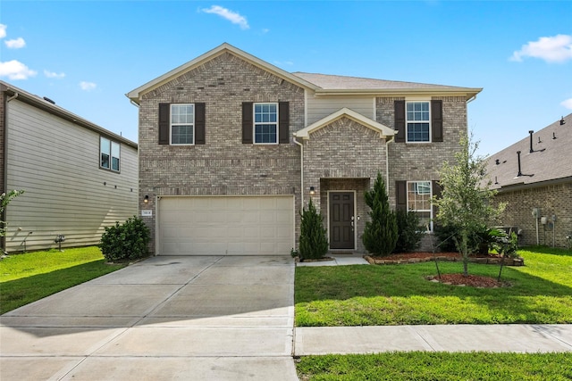 view of front property with a garage and a front yard