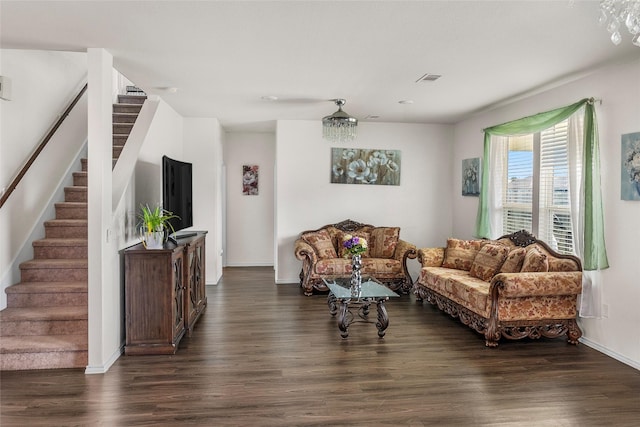 living room with dark hardwood / wood-style flooring