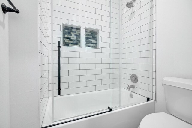 113 County Road 645, Kenefick, TX 77535 - bathroom with enclosed tub / shower combo and toilet
