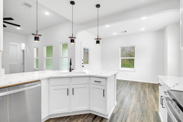 113 County Road 645, Kenefick, TX 77535 - kitchen with hanging light fixtures, white cabinetry, sink, and stainless steel dishwasher