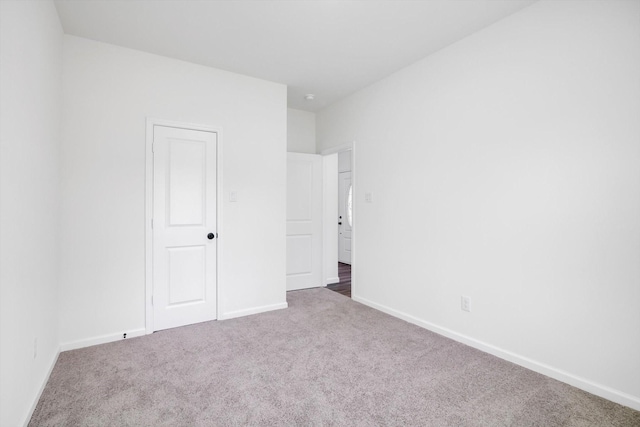 113 County Road 645, Kenefick, TX 77535 - unfurnished bedroom featuring dark carpet