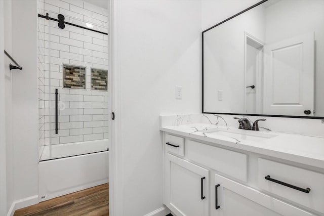 113 County Road 645, Kenefick, TX 77535 - bathroom with vanity, hardwood / wood-style flooring, and tiled shower / bath