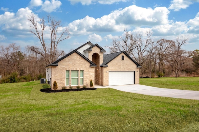 113 County Road 645, Kenefick, TX 77535 - view of front of property with central AC, a garage, and a front lawn