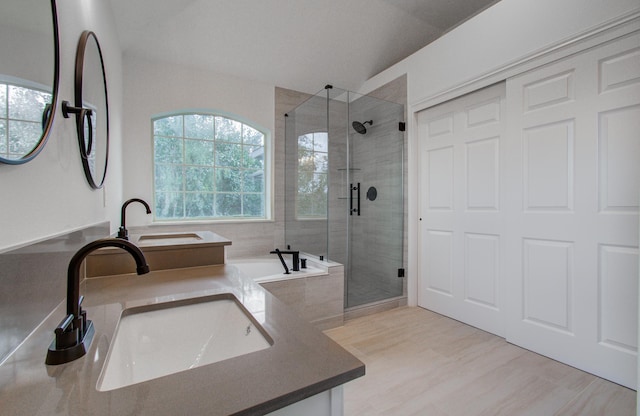 bathroom featuring vanity, shower with separate bathtub, and hardwood / wood-style floors