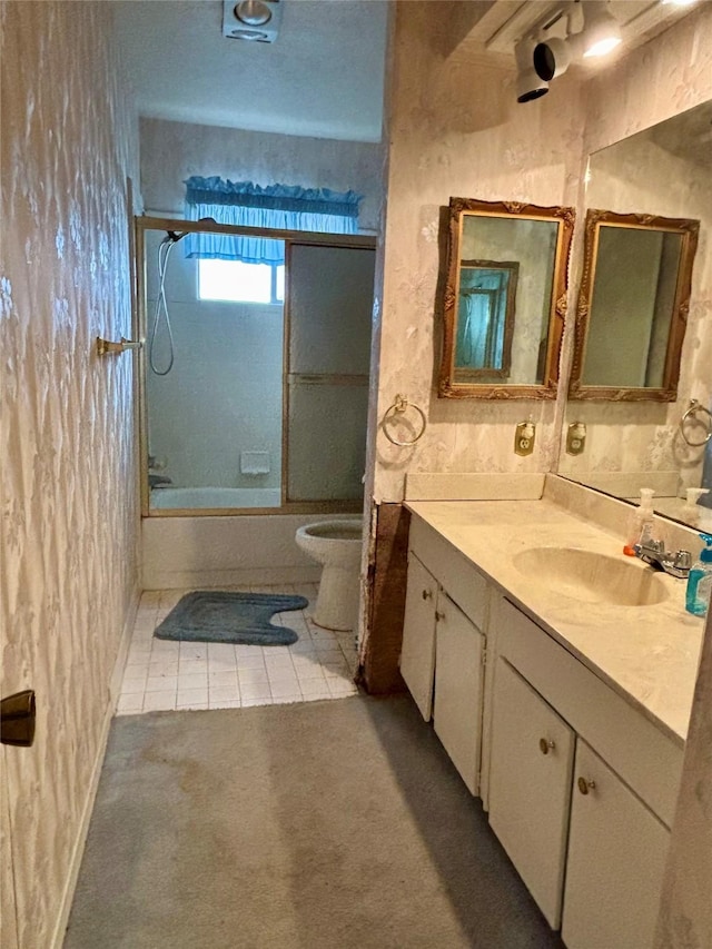 full bathroom with vanity, tile patterned floors, shower / bath combination with glass door, and toilet