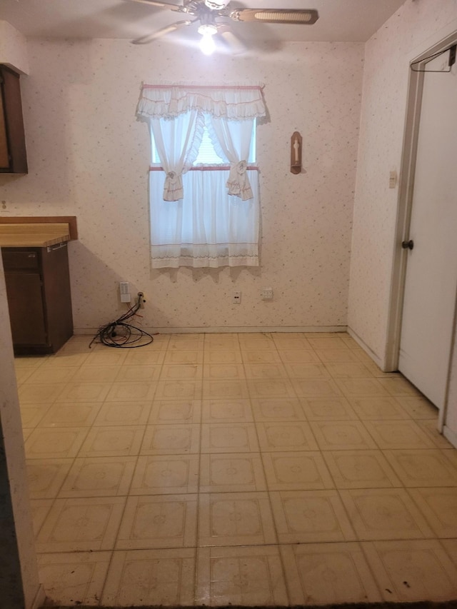 unfurnished dining area with ceiling fan