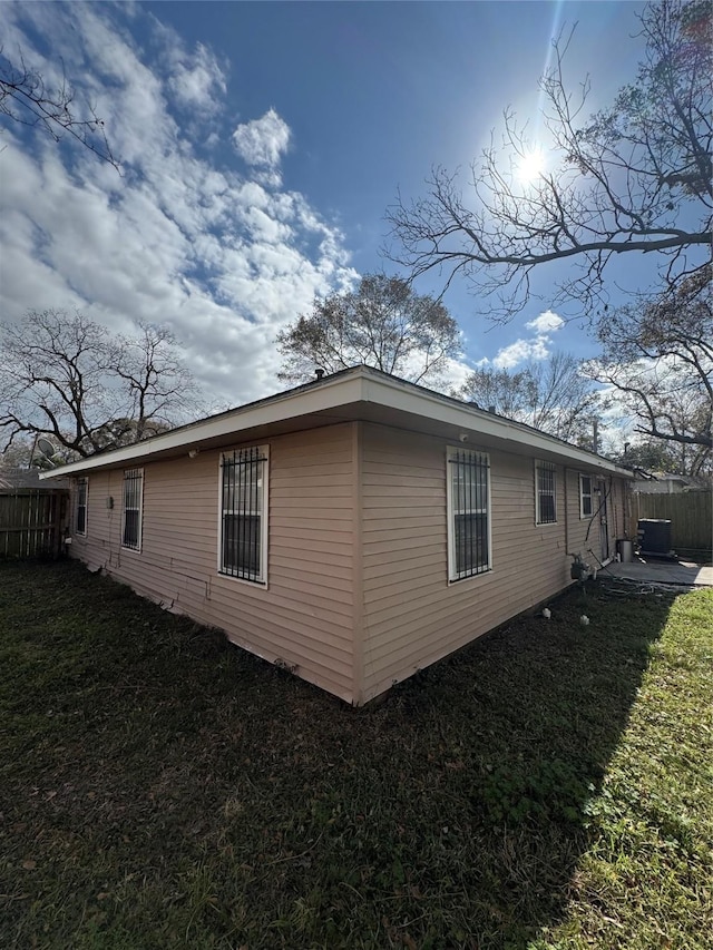 view of home's exterior featuring a yard