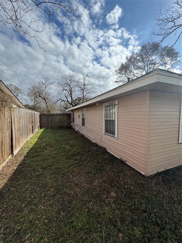 view of property exterior featuring a yard