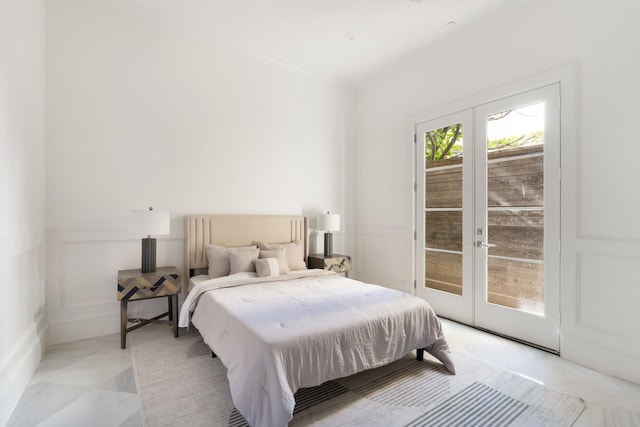 bedroom featuring french doors, ornamental molding, and access to exterior