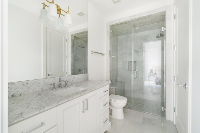 bathroom with vanity, walk in shower, and toilet