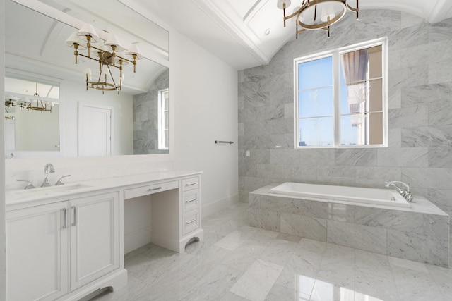 bathroom featuring vanity, lofted ceiling, tiled bath, and a notable chandelier