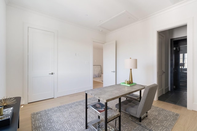 office featuring crown molding and light hardwood / wood-style floors