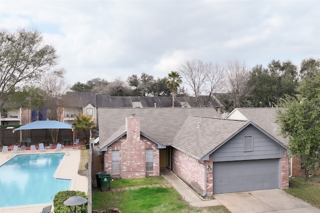 pool featuring a patio area and fence