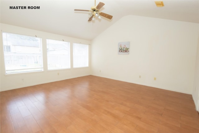 empty room with a healthy amount of sunlight, light wood-style floors, and ceiling fan