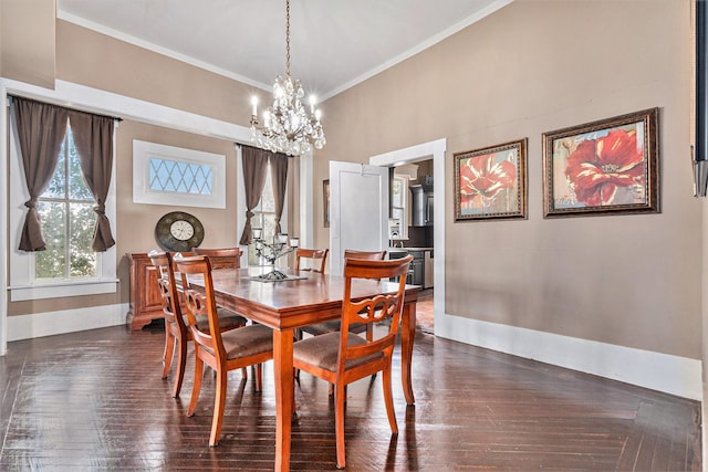 dining room with crown molding, dark hardwood / wood-style floors, and a notable chandelier