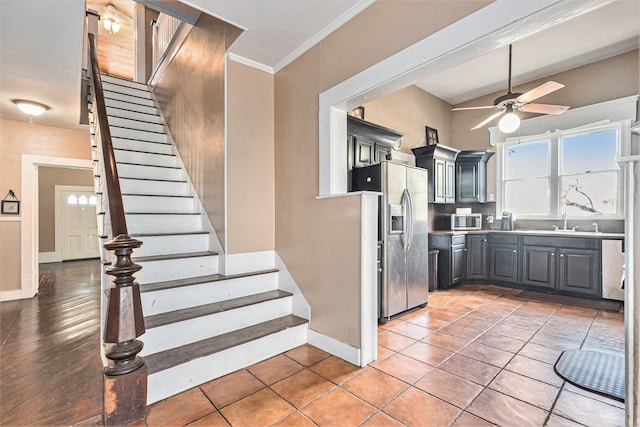 kitchen featuring sink, gray cabinetry, ornamental molding, ceiling fan, and stainless steel appliances