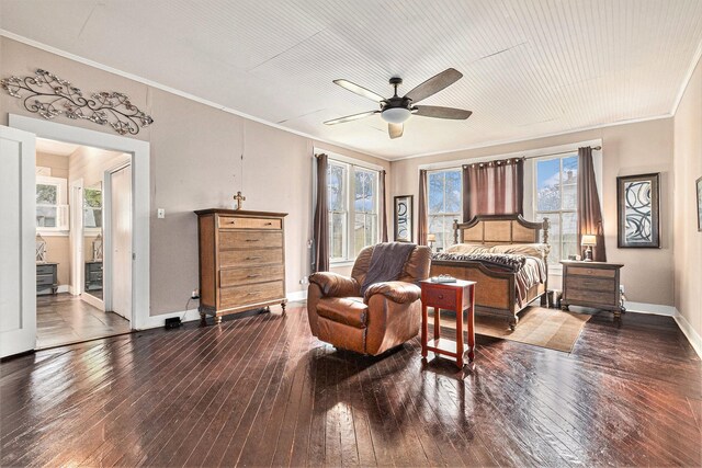 bedroom with hardwood / wood-style flooring, crown molding, and ceiling fan