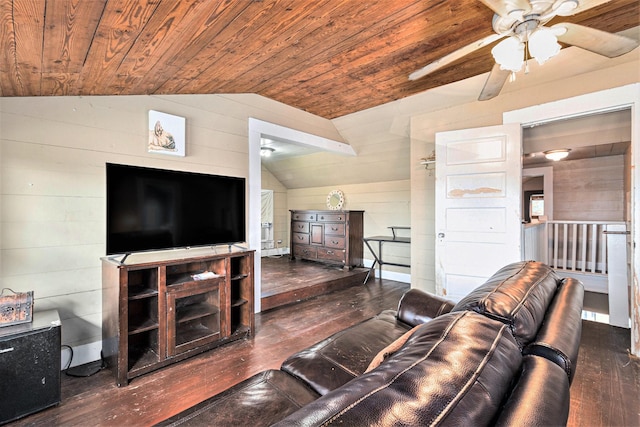 living room with wooden walls, lofted ceiling, dark hardwood / wood-style flooring, and wooden ceiling