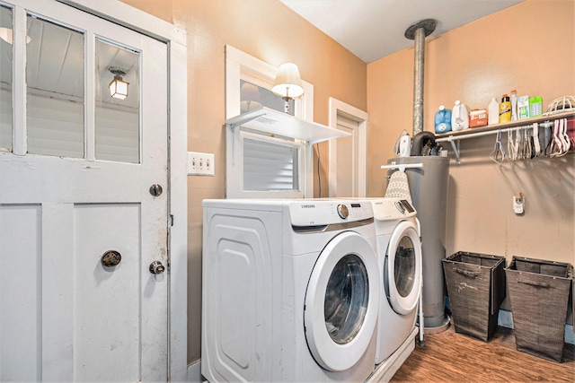 washroom featuring wood-type flooring and washer and clothes dryer