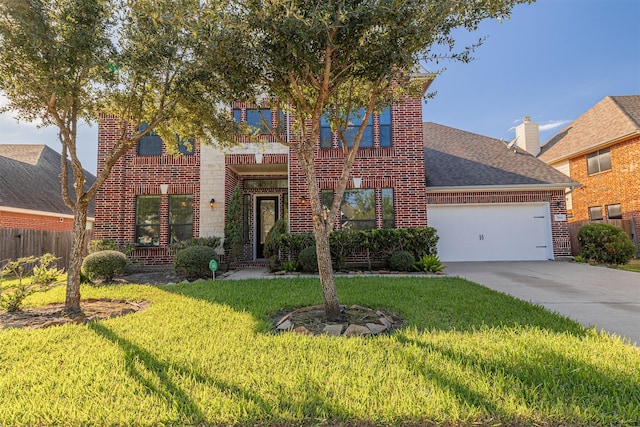 view of front of house with a garage and a front yard