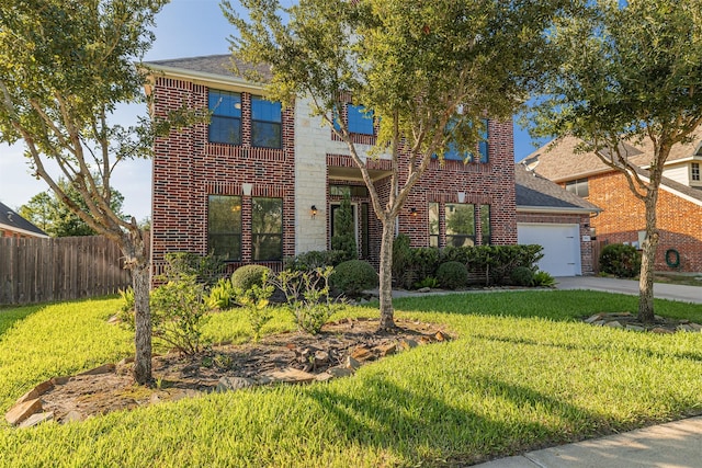 view of front of house with a garage and a front lawn