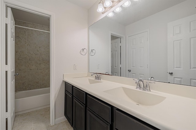 bathroom with vanity and tiled shower / bath