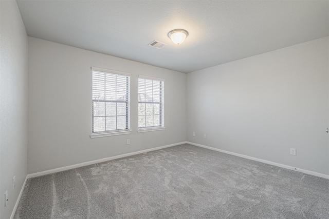 unfurnished room with carpet