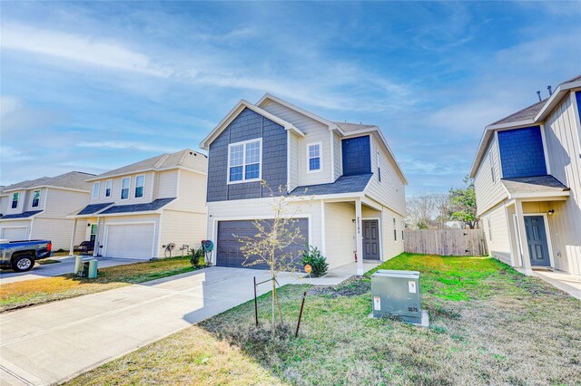 view of front of home featuring a garage and a front yard