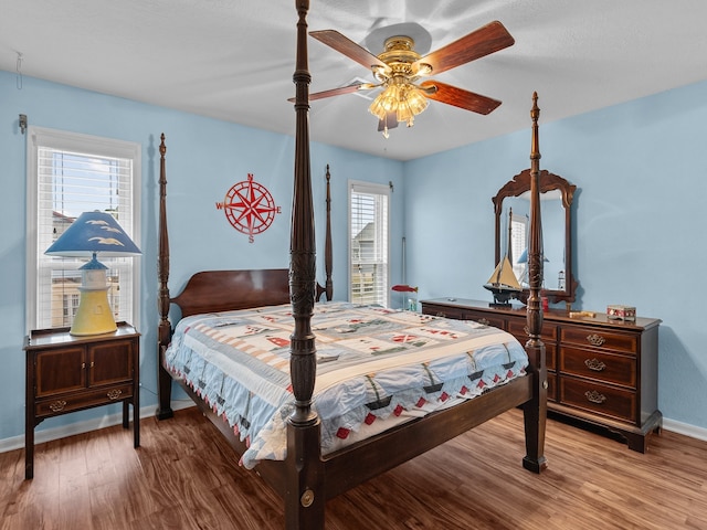 bedroom featuring hardwood / wood-style flooring and ceiling fan