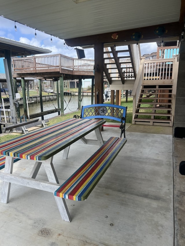 view of community featuring a water view and a dock