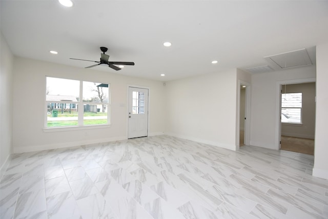 spare room with recessed lighting, baseboards, and ceiling fan