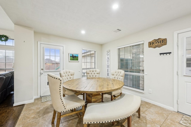 dining area featuring light tile patterned floors