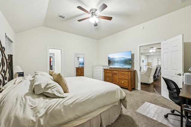 carpeted bedroom featuring lofted ceiling and ceiling fan