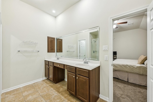 bathroom with vanity, vaulted ceiling, tile patterned floors, and ceiling fan