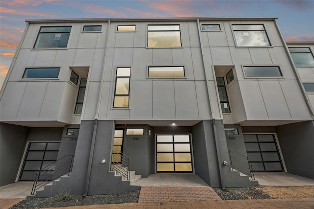 view of outdoor building at dusk