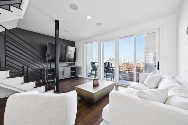 living room with dark hardwood / wood-style flooring